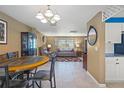 Open dining area with a round table and chairs, flows into the living room at 584 Beverly Rd, Venice, FL 34293