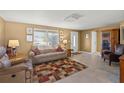 Bright living room with neutral decor and tiled floors at 584 Beverly Rd, Venice, FL 34293