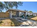 Front exterior view of single-story home with covered porch and driveway at 2003 Princeton Ave, Bradenton, FL 34207