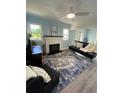 Bright living room with fireplace, comfy seating, and stylish rug at 222 27Th W St, Bradenton, FL 34205