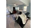 Living room features a fireplace and a black couch at 222 27Th W St, Bradenton, FL 34205