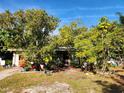 Ranch home nestled among lush greenery, offering a tranquil setting at 3181 Irving St, Sarasota, FL 34237