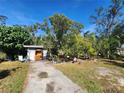 Charming ranch home with a large front yard and mature trees at 3181 Irving St, Sarasota, FL 34237