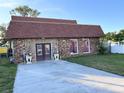 Brick home with a red roof and a spacious driveway at 5630 3Rd W St, Bradenton, FL 34207