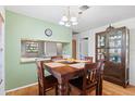Dining area with wooden table and view into the kitchen at 608 N Jefferson Ave # 30, Sarasota, FL 34237