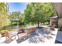 Spacious patio overlooking a serene canal with seating at 7707 10Th Nw Ave, Bradenton, FL 34209