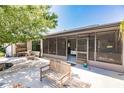 Screened patio with seating area and access to the backyard at 7707 10Th Nw Ave, Bradenton, FL 34209