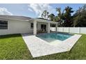 Beautiful backyard pool with patio and a well-maintained lawn, perfect for outdoor entertaining and relaxation at 1859 Lamont St, North Port, FL 34288