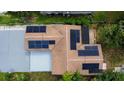 Aerial view showcasing a home equipped with solar panels on the roof at 2554 Novus St, Sarasota, FL 34237