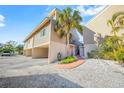 Exterior view of beach house featuring parking and walkway at 3801 4Th Ave # 5, Holmes Beach, FL 34217