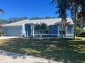 Charming single-story house featuring a spacious yard and attached garage at 4612 35Th E Ave, Palmetto, FL 34221