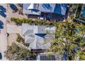 Aerial view showcasing the home's gray roof and location in a tropical neighborhood at 633 Calle De Peru, Sarasota, FL 34242