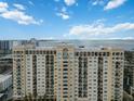 High-rise building with water and city views at 750 N Tamiami Trl # 420, Sarasota, FL 34236