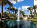 Resort-style pond with fountain and bridge at 750 N Tamiami Trl # 420, Sarasota, FL 34236