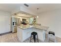 Modern kitchen with granite countertops and stainless steel appliances at 1477 Dogwood Dr, Sarasota, FL 34232