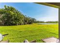 Relaxing view of a pond from a backyard patio at 16108 62Nd E Gln, Parrish, FL 34219