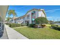 Well-maintained condo building with lush landscaping at 4308 Madeira Ct # 3336, Sarasota, FL 34233