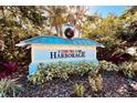 Harborage community entrance sign surrounded by lush landscaping at 5613 Key Largo Ct, Bradenton, FL 34203