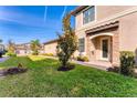 Inviting front entrance with stone accents and landscaping at 6035 Worsham Ln # 104, Lakewood Ranch, FL 34211