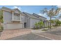 Gray sided home with two-car garage and brick driveway at 1775 Stapleton St, Sarasota, FL 34239