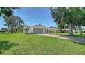Well-maintained lawn leads to a lovely single-story home with a two-car garage and arched entryway at 4409 Eleuthera Ct, Sarasota, FL 34233