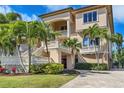 Mediterranean style home with lush landscaping at 507 Casey Key Rd, Nokomis, FL 34275