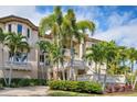 Grand two-story home with palm trees and landscaping at 507 Casey Key Rd, Nokomis, FL 34275