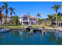 Waterfront home with private dock and lush landscaping, offering stunning views at 508 Siesta Dr, Sarasota, FL 34242