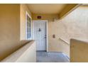 View of the condo entrance, showing a white door, window, and access ramp at 1130 Villagio Cir # 203, Sarasota, FL 34237