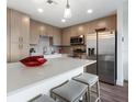 Modern kitchen with stainless steel appliances and an island at 1709 N Tamiami Trl # A421, Sarasota, FL 34234