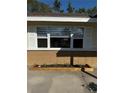 House exterior featuring a window with shutters and a garden at 2715 Nancy St, Sarasota, FL 34237