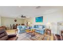 Inviting living area with two sofas, an area rug, and access to a dining space at 1220 26Th W St, Bradenton, FL 34205