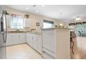 Spacious kitchen with white cabinets and granite countertops at 24181 Green Heron Dr # 84, Punta Gorda, FL 33980