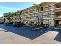 Two-story condo building with parking and landscaping at 425 30Th W Ave # C107, Bradenton, FL 34205