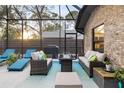 An outdoor patio area with comfortable seating, a fire pit, and a grill at 5706 Bent Oak Dr, Sarasota, FL 34232
