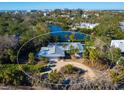 Bird's-eye view of single-story home on waterfront lot at 1221 S Basin Ln, Sarasota, FL 34242