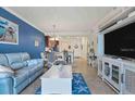 Spacious living area with comfortable seating and a large TV at 17118 Vardon Ter # 305, Bradenton, FL 34211