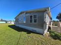 Side view of a single-story house at 3105 Sunrise Trl, Port Charlotte, FL 33952