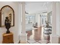 Bright entry with hardwood floors and views to living room at 35 Watergate Dr # 801, Sarasota, FL 34236