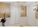 Elegant lobby with elevator and mosaic wall at 35 Watergate Dr # 801, Sarasota, FL 34236
