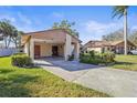 Attached carport featuring a covered parking area and neat landscaping at 5111 26Th St. Ct, W # 53, Bradenton, FL 34207