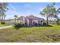 Well-maintained single-story home with a lush green lawn and mature trees in a desirable neighborhood at 5111 26Th St. Ct, W # 53, Bradenton, FL 34207