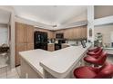 L-shaped kitchen with ample counter space and wood cabinets at 9443 Burnam Dr, Weeki Wachee, FL 34613