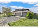 House exterior showcasing a two-car garage and landscaping at 13126 Indigo Way, Bradenton, FL 34211