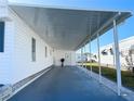 Covered carport provides shade and parking at 3334 Overcup Oak Ter, Sarasota, FL 34237