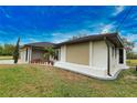 Contemporary home showcasing a sleek design and well-manicured landscaping at 3479 Knox Ter, Port Charlotte, FL 33948