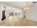 Open living space with tile floors and a view of the backyard at 3614 Summerwind Cir, Bradenton, FL 34209