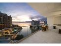 Evening balcony view overlooking city and water at 401 Quay Commons # 901, Sarasota, FL 34236