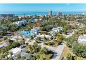 Beautiful aerial shot of a home nestled in a lush coastal neighborhood with ocean views at 5302 Las Rosas, Sarasota, FL 34242