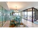 Dining area with waterfront views and sliding glass doors to balcony at 5633 Puerta Del Sol S Blvd # 307, St Petersburg, FL 33715